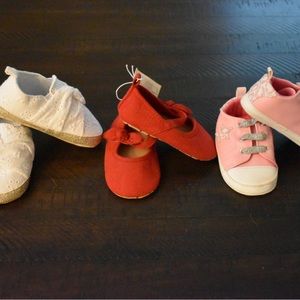 3 pairs of soft bottom baby girl shoes.  Size 6-12 months.